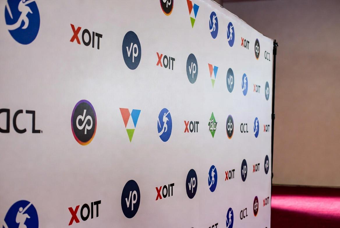 custom step and repeat banner as premium trade show backdrop step and repeat banner 2026 merch trends trade show giveaways trade show displays top trade show booth giveaways trade show merch that lands deals Diversified Printing Services rush order promo products custom rush order products trade show trends 2026