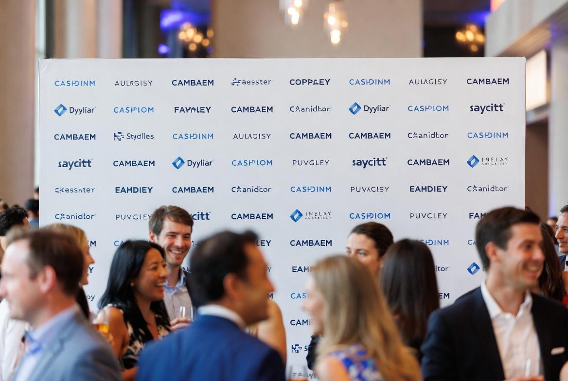 Custom step and repeat banners at corporate event with logo repeats