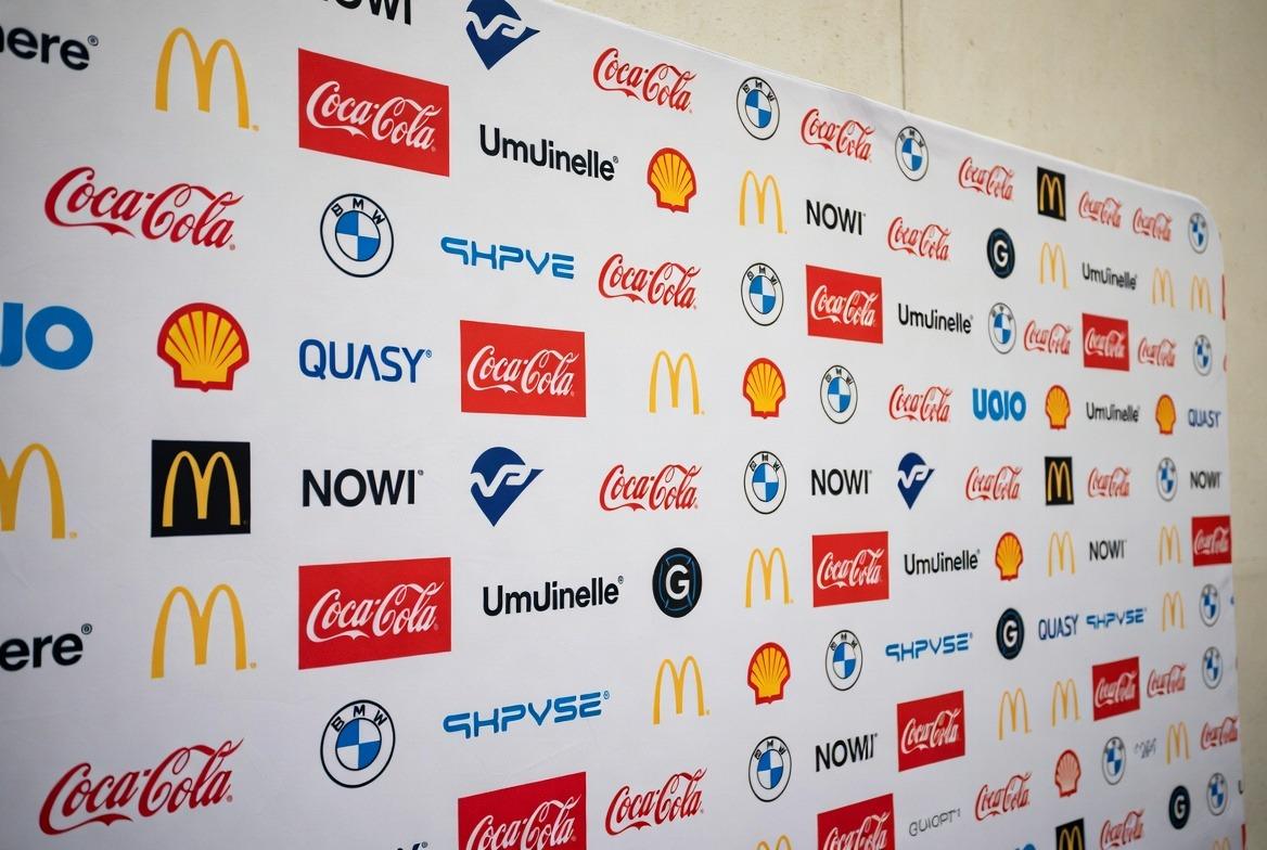 Close up repeating logos on fabric promotional step and repeat banner retractable step and repeat banners 