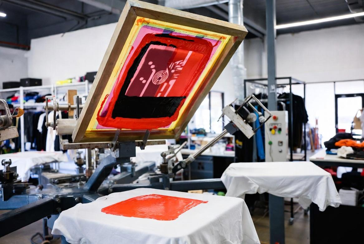 Custom Screen Printing apparel t shirts on professional press machine Arizona Rush Custom Screen Printing Custom Apparel Printing Nationwide Screen Printing Bulk T Shirt Printing Event Screen Printing Fast Turnaround Screen Printing Custom T Shirt Printing Screen Printing Services Rush T Shirt Orders Promotional Products for Events